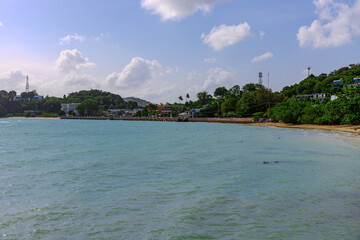 Turquoise blue waters and Lush green islands of the coast of Cape Panwa located on the eastern side of Phuket island in Thailand