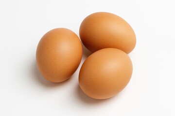 Three eggs displayed on a plain white surface