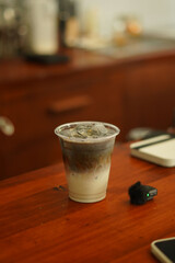 A Cup of milkshake topping white black sesame on the wood table