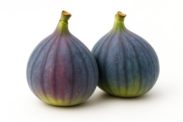 Two fresh and ripe figs displayed on a white backdrop