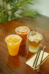 Closeup of Iced Caramel Macchiato at the coffee shop, Caramel Macchiato is a classic macchiato beverage. It consists of vanilla syrup, espresso, steamed milk, foam, and caramel drizzle