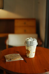 A Cup of milkshake topping white black sesame on the wood table