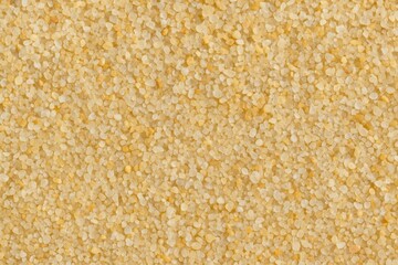 Close-up of textured coarse sand particles on a tropical-themed backdrop