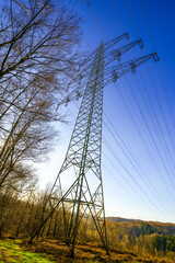 Winter landscape with power lines near Wuppertal. Nature in the forest.

