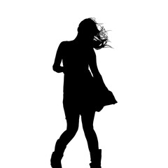 Fototapeta premium Silhouette of Young Woman Dancing in Dress with Windblown Hair