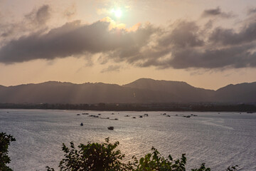 Sunset Beautiful view from Kao Khad next to Cape Panwa on the island of Phuket Thailand. Views of the turquoise Blue waters of the Andaman Sea and small islands off the coat of Phuket