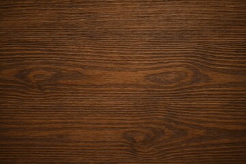Fototapeta premium Warm-toned wooden surface with natural grain patterns