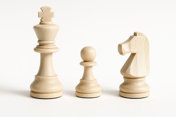 Three white wooden chess pieces isolated on a white background