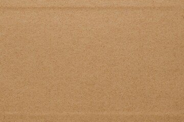 Eco-friendly textured cardboard made from recycled materials with natural fiber inclusions