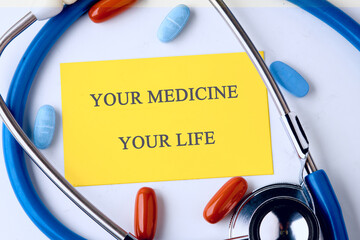 The conceptual phrase is YOUR MEDICINE YOUR LIFE. Invest in your health Concept.