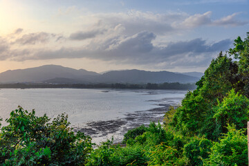 Sunset Beautiful view from Kao Khad next to Cape Panwa on the island of Phuket Thailand. Views of the turquoise Blue waters of the Andaman Sea and small islands off the coat of Phuket
