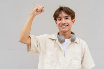 Person with fist and arm raised portrait
