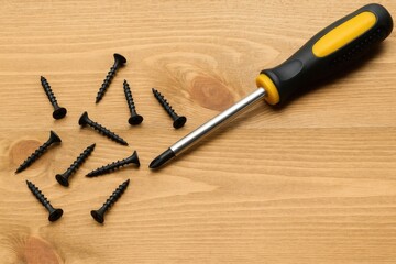Hand tools on a rustic wooden surface illustrating repair work