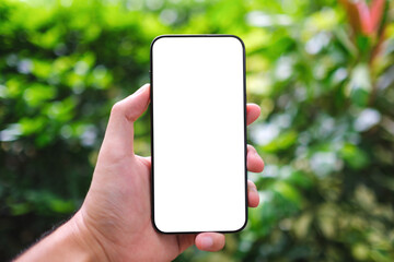 Mockup image of a man holding mobile phone with blank screen in the outdoors