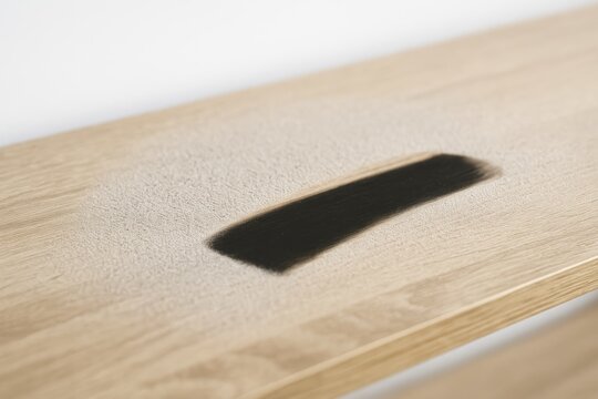 Dusty residue scattered across a shelf surface