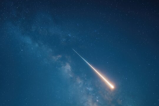 A falling star streaking across the night sky