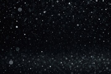 Winter snowfall pattern with blurred luminous spots on a dark backdrop