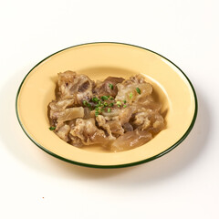 Bowl of boiled beef tendon served in yellow enamel dish, garnished with chopped green herbs, showcasing traditional Asian dish with gelatinous texture and savory flavor