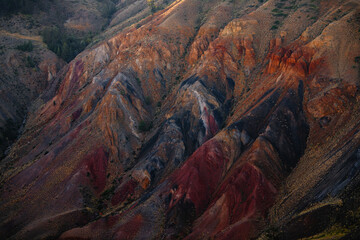 Stunning multicolored mountain landscape with vibrant striations and textured terrain, Mars field...