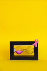 Minimalist conceptual image symbolizing breast cancer awareness and the urgency of early detection....
