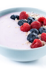 Healthy smoothie bowl with berries isolated on white background. Close up