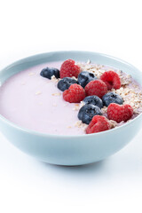 Healthy smoothie bowl with berries isolated on white background