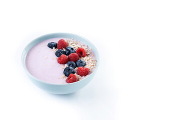 Healthy smoothie bowl with berries isolated on white background. Copy space