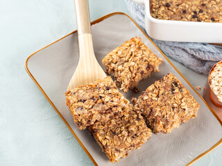 Baked oatmeal peanut butter banana cake bars with chocolate chips
