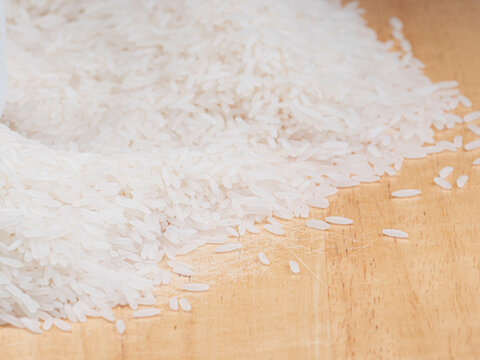Raw White Jasmine Rice on Wooden Surface