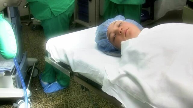 Teen girl on operating table in hospital 