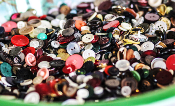 An antique bowl full of unmatched buttons