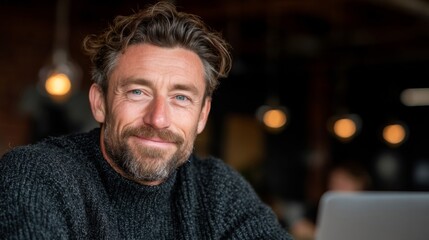 Portrait of a Smiling Man with Beard in a Casual Sweater