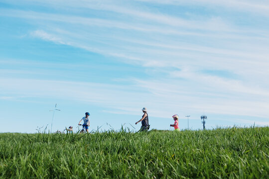 Low view of family out for a walk / ride
