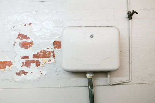 Urinal Cistern in an old Public Toilet