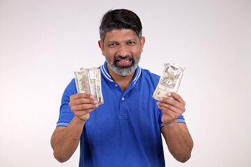 Indian man showing currency on white background