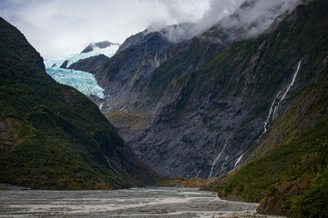 powerful blue glacier tongue of Franz Josef Glacier seen from Sentinel Rock Viewpoint, Westland Tai...