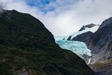 powerful blue glacier tongue of Franz Josef Glacier seen from Sentinel Rock Viewpoint, Westland Tai...