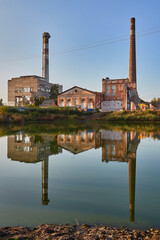 Derelict Factory Reflection in Calm Water
