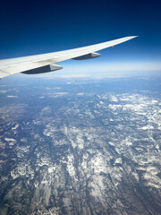 Fototapeta premium View from a plane passing over the frozen landscape of northern Canada and the Labrador Sea.