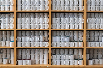 stack of mug cups on the shelf
