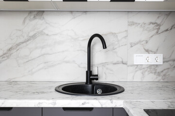 kitchen faucet on a stylish metal sink