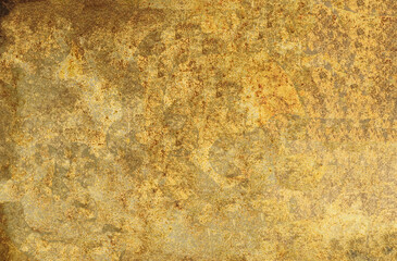 Gold textured background showing rough surface with stains