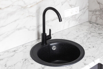 kitchen faucet on a stylish metal sink