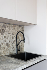 kitchen faucet on a stylish metal sink