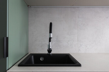 kitchen faucet on a stylish metal sink