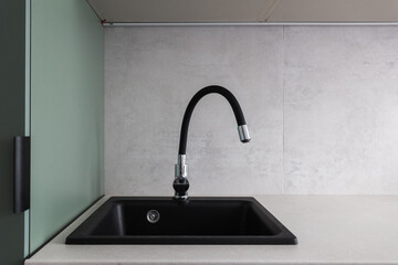kitchen faucet on a stylish metal sink