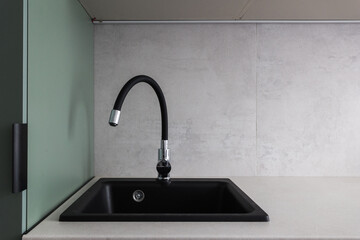kitchen faucet on a stylish metal sink