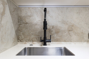 kitchen faucet on a stylish metal sink