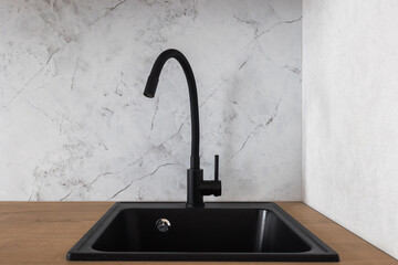 kitchen faucet on a stylish metal sink