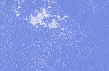 Cracked paint texture creating a distressed background in light blue and white